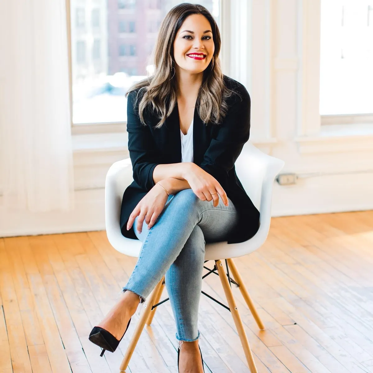 Bobbi Tanguay, Winnipeg dating coach, seated in a sunlit loft