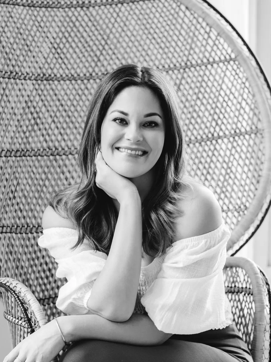 Bobbi Tanguay, dating coach and founder of Love Collective Introductions, in a wicker chair