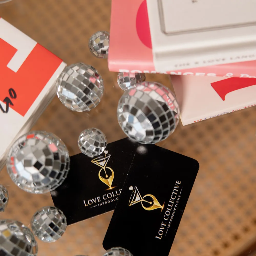 Love Collective Introductions member cards and mirror-ball details